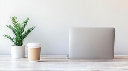 Fototapeta premium Sleek Minimalist Workspace with Laptop and Coffee Cup