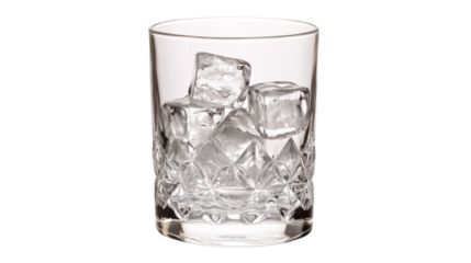 Crystal whiskey glass containing ice cubes on transparent background