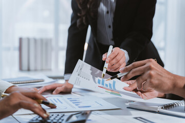 Business people analyzing financial charts and graphs showing market data