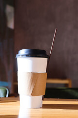 Blank paper coffee cup on the table.