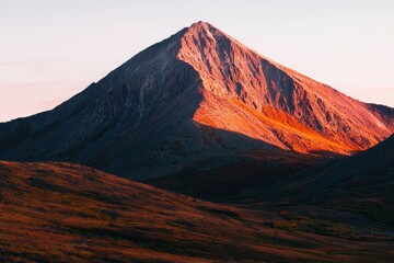 Majestic Mountain Peak Illuminated By Sunset Glow