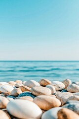 Smooth Beach Stones Near Calm Ocean Water