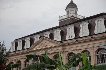 Building façades, historical architecture, and city streets in downtown New Orleans. 