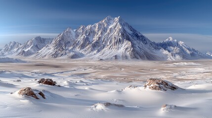 Obraz premium Majestic snow-capped mountain range, winter landscape, desert foreground, travel poster