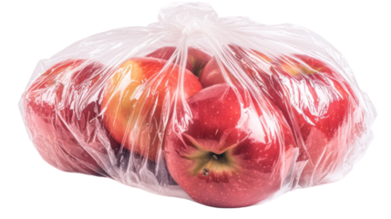 Red apples inside transparent plastic bag on checkered background