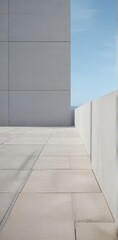 Fototapeta premium Modern Architectural Exterior A Minimalist Perspective of Light Stone Pavers and Walls Against a Clear Sky