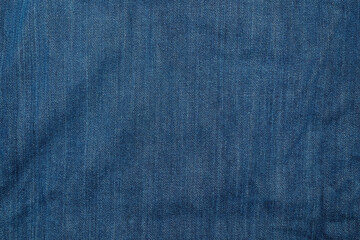Abstract texture background of wrinkled blue jean fabric.Surface of jeans fabric.Natural pattern...