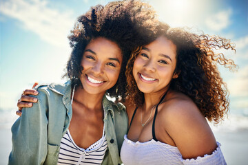 Fototapeta premium Friends, women and portrait at beach together for holiday trip, travel adventure or fun bonding. Wellness, people and smile with embrace by seaside for vacation support, fresh air or relaxing weekend