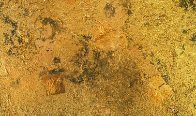 Shiny gold foil abstract texture background. Golden wall backdrop with distressed finish for luxury design.