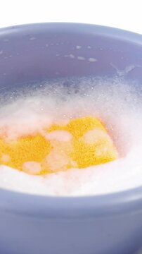 Plastic bucket with cleaning sponge