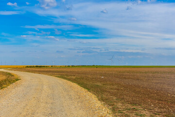 Wind turbines at the agricultural field. Clean energy. Ecological concept