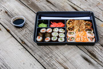 Set of the different sushi on wooden table