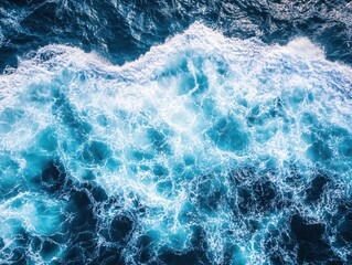 Fototapeta premium Aerial View of Ocean Waves Crashing with White Foam and Deep Blue Water Texture