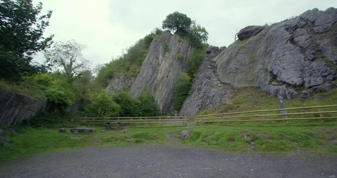 Panning wide shot of Dinas rock at Coed-Y-Rhaidyr, Pontneddfechan