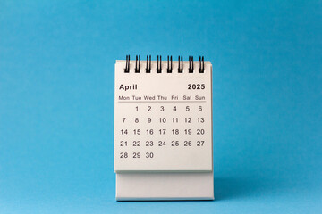 Planning calendar for April 2025 on a blue background.