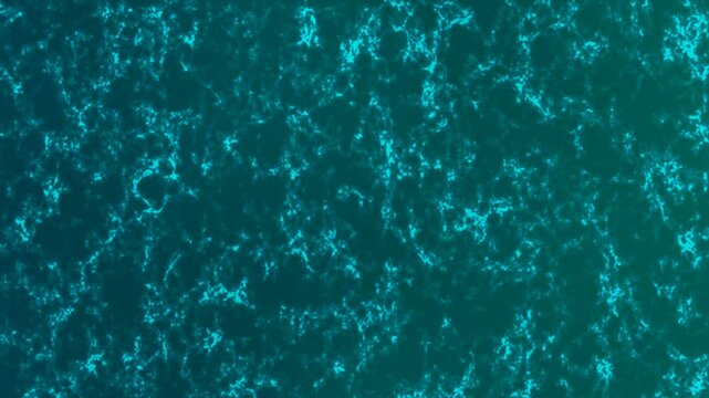 Blue water surface. Slow motion clean swimming pool ripples and wave. Top view sun shine water background. 