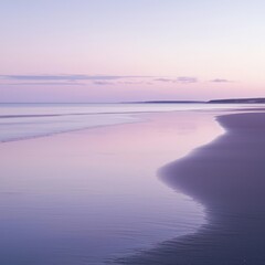 Fototapeta premium A tranquil beach scene at sunset, featuring soft pink and blue pastel hues reflecting on the calm water and sand.