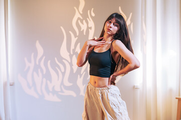 Dancer showcasing skill and grace in a stylish indoor setting with creative lighting