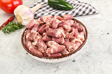 Fresh raw chicken hearts in the bowl