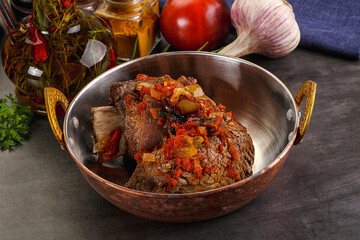 Baked beef ribs with vegetables
