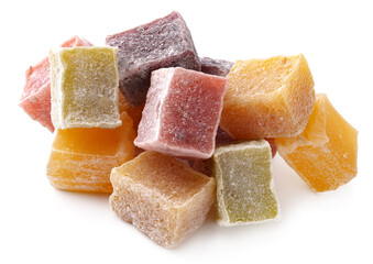 Colorful Turkish delight pieces arranged in a decorative manner on a white surface showcasing their texture and flavors