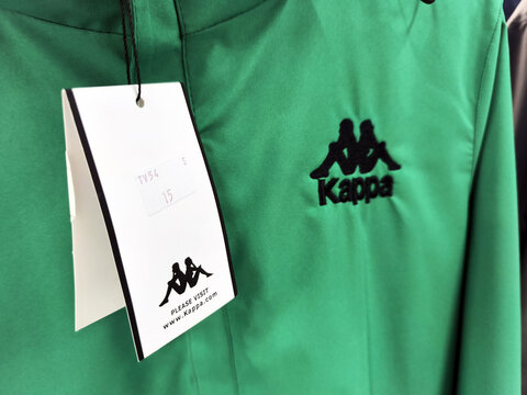 Green kappa jacket with logo and size tag