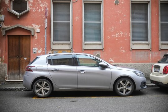 Silver Peugeot 308 parked on the street
