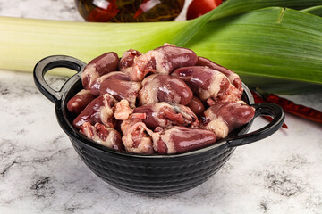 Raw chicken hearts in the bowl