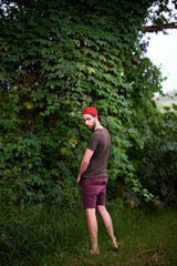 Travel, man and peeing outdoor in nature, hiking or adventure for holiday trip in countryside....