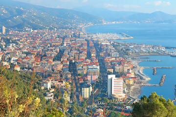 Chiavari, Italy - December 29, 2024. Resort town by sea. Tourism, marina, yachts and recreation. View from mountain on sunny day. 