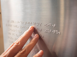 Braille Alphabet with People hand Reading Blind Public building signage design