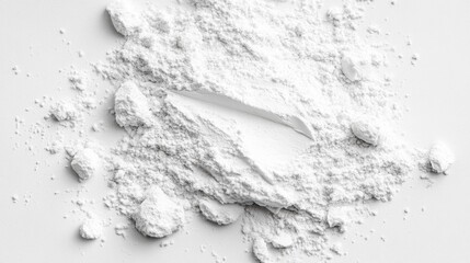 Fine white powder on a smooth surface.