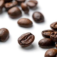 Naklejka premium Roasted coffee beans scattered on white background, close-up, food photography, for packaging