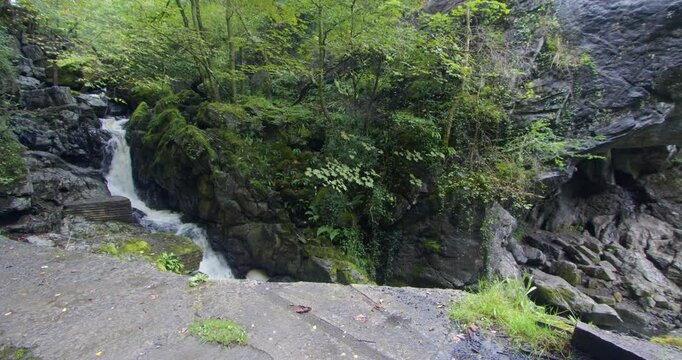 Extra Wide shot of a waterfall on the river sychryd at Coed-Y-Rhaidyr, Pontneddfechan, Neath,