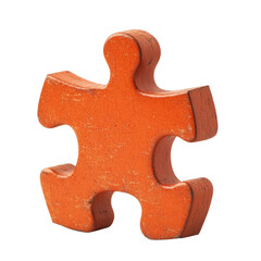 Obraz premium A weathered orange wooden jigsaw puzzle piece is shown isolated against a black background.