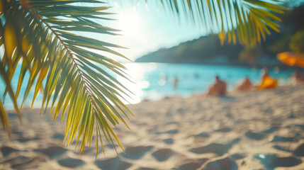 Fototapeta premium palm leaves on a blurred background of a beach with tourists. The concept of summer holidays, vacations and travel