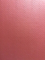 A red checkered patterned background with a pinkish hue