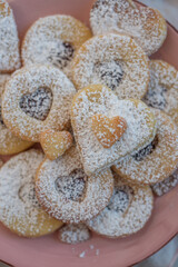 Linzer cookies with heart with raspberry jam and powdered sugar 