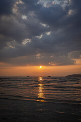Beautiful landscape of the Andaman Sea and cloudy sky during sunset at the Railay West Beach in Railay, Krabi, Thailand.