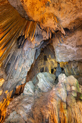 Stalactites and other rock formations at the scenic and illuminated Diamond Cave (Tham Phra Nang...