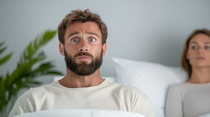 Fototapeta premium newborn wailing in hospital bassinet as stunned father stares at it mother lying in bed with exhausted expression sterile white blue walls 