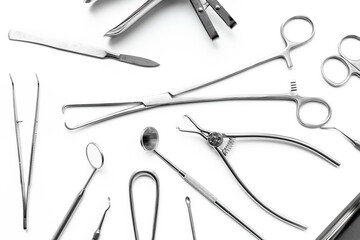 Flat lay of surgical stainless metal hand tools. Professional medical equipment and instruments