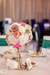 Luxury, elegant wedding reception table arrangement, floral centerpiece