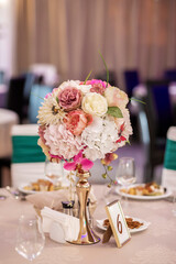 Luxury, elegant wedding reception table arrangement, floral centerpiece