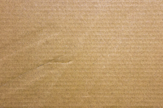 Brown cardboard sheet abstract background, texture of recycle paper box in old vintage pattern for design art work.