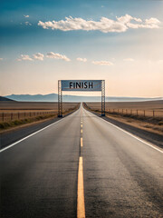 Fototapeta premium Straight Road Leading to the Finish Line Under a Clear Sky at Sunset in an Open Landscape