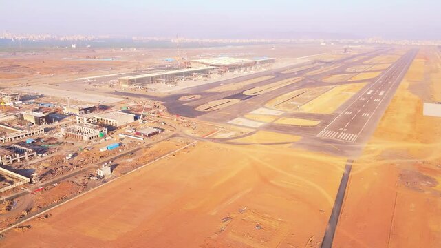 Drone shot unfinished airport site with multiple airstrips