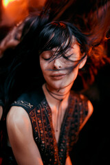 A woman is shown in a colorful, abstract background