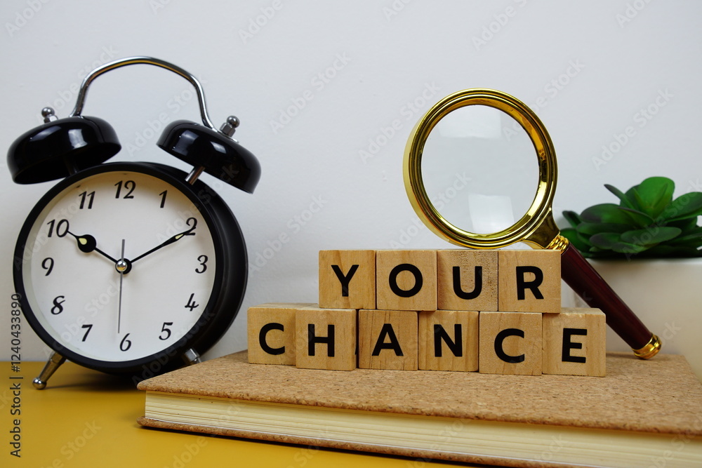 Poster magnifying glass and alarm clock with wooden blocks alphabet letters your chance text message on yel