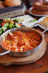 Turkish Menemen omelet in a frying pan. .